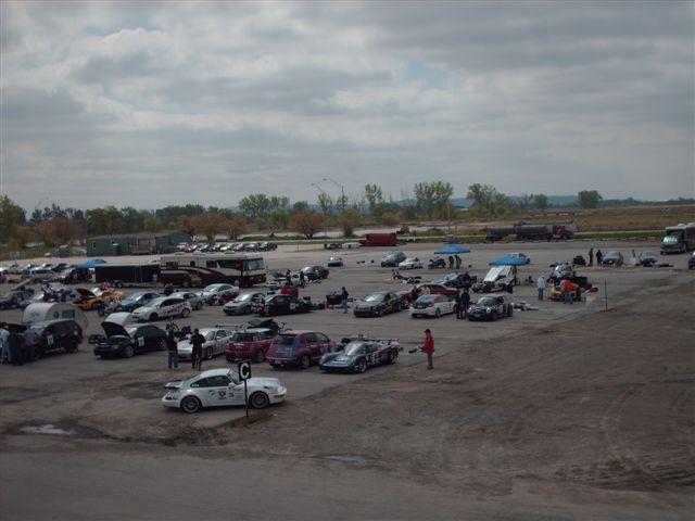The paddock at Mid America Motorsports Park.  Note teardrop trailer that was pulled by the VW Bug.