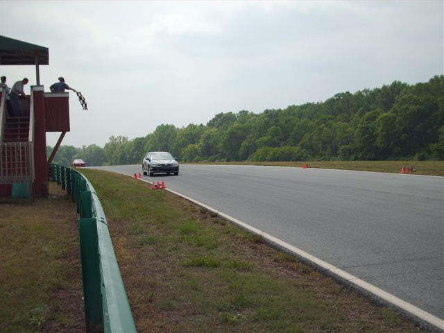 the Mazda at speed and getting the checker at VIR.