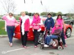 The "Girls in Pink" pose in front of Brock Yates' Bentley